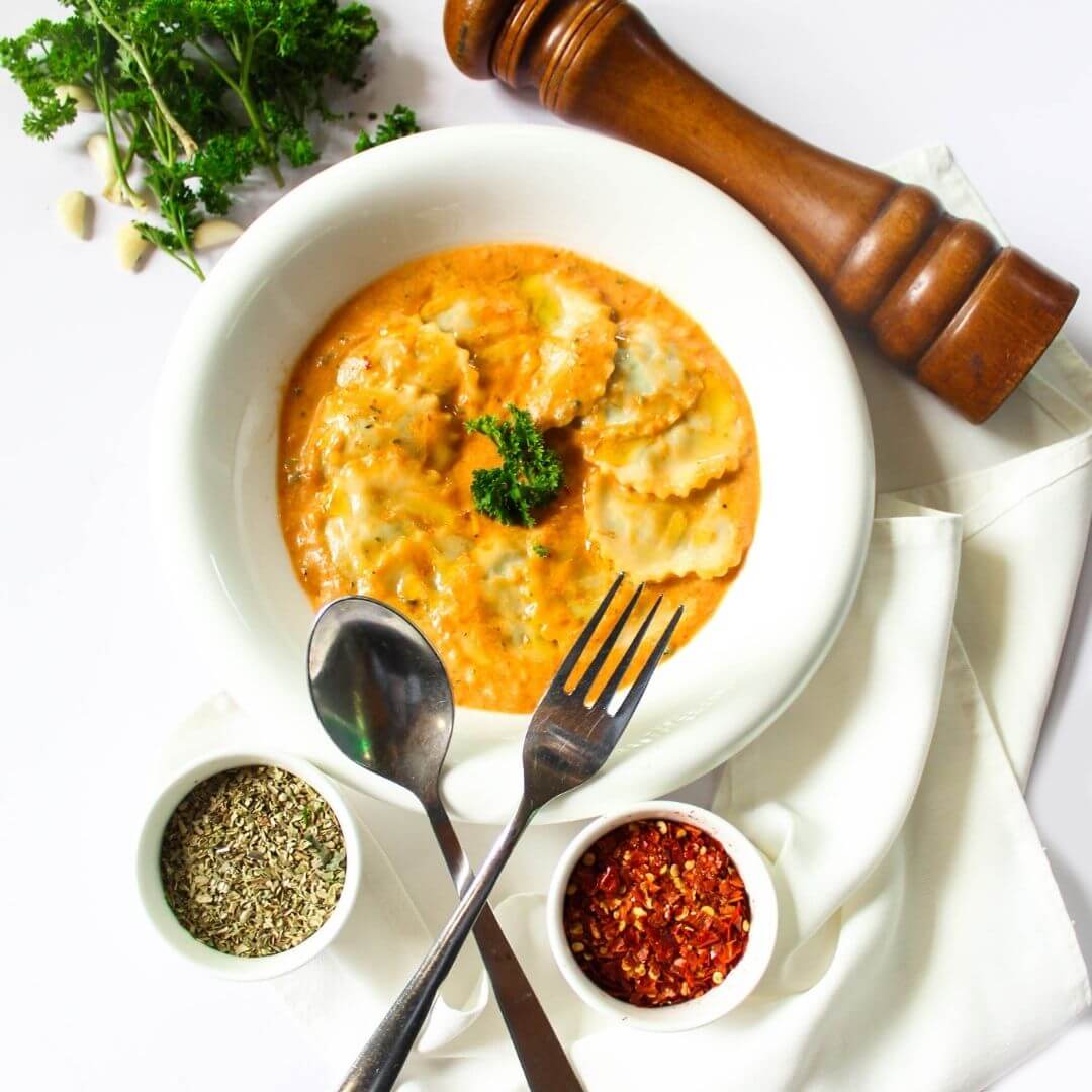 Little Italy’s Signature spinach ravioli in a pink cheese sauce